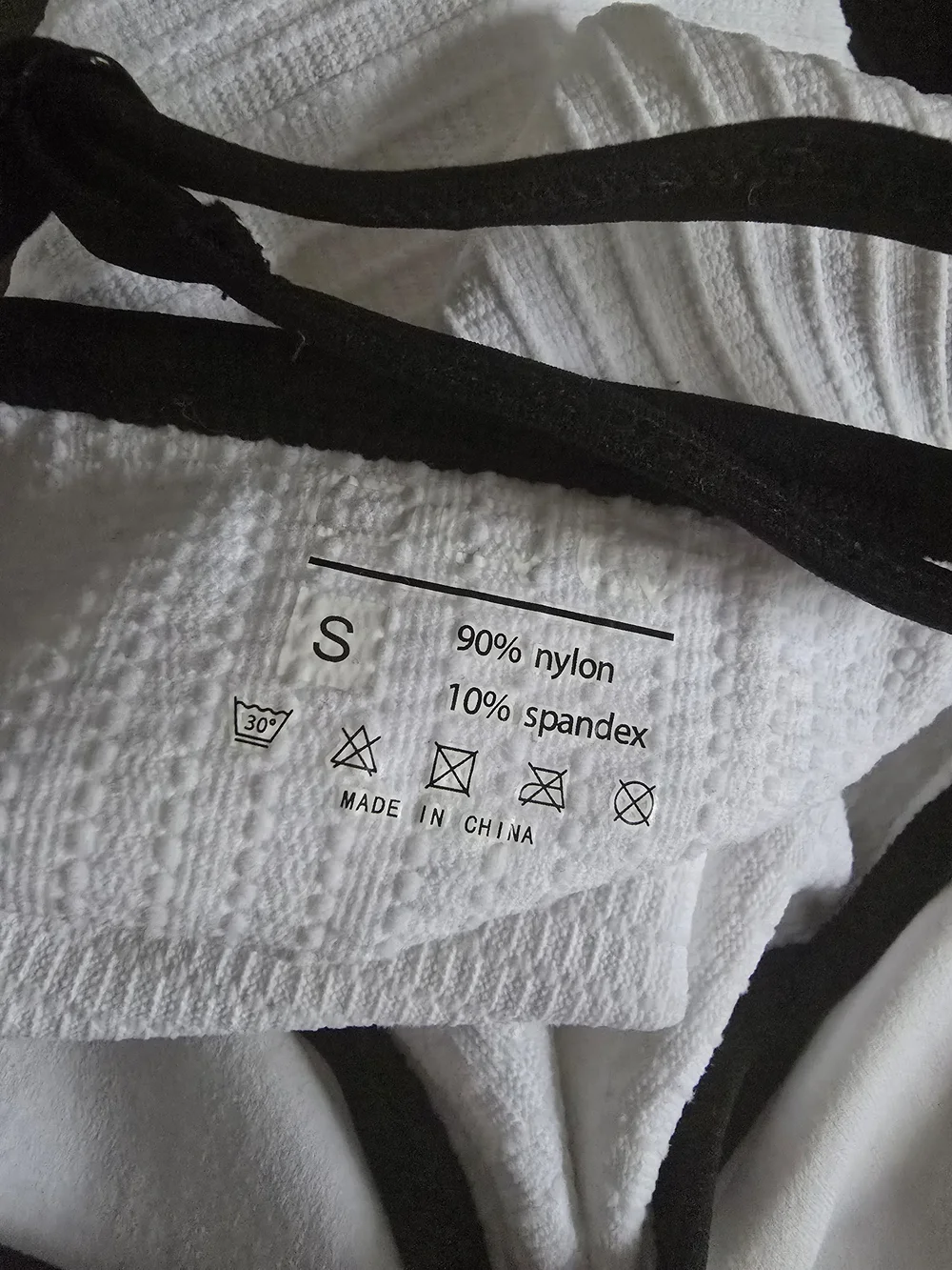 White Ribbed One-Piece Swimsuit with Black Trim. Size Small. NWOT.